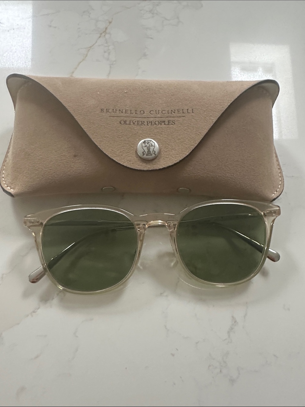 Oliver Peoples Transparent Frame Sunglasses with Green Lenses